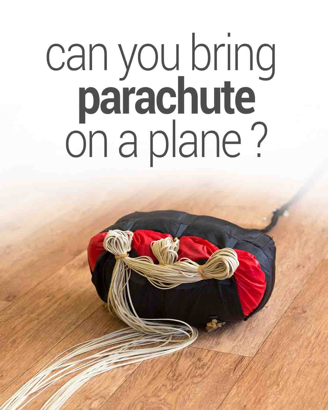 Text reads “can you bring parachute on a plane?” above a packed red-and-black parachute with bundled cords resting on a wooden floor