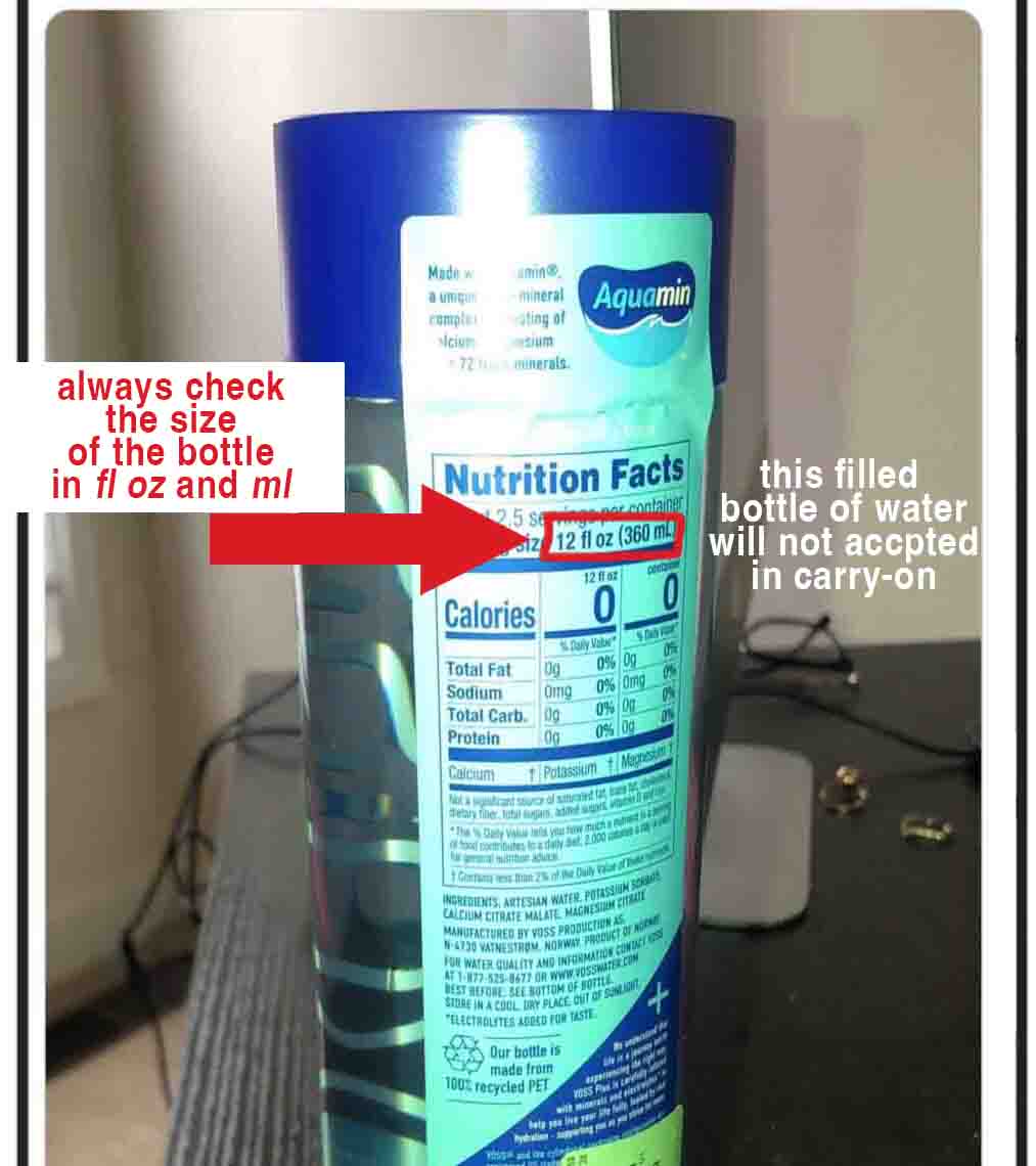 Close-up of a water bottle label showing 12 fl oz (360 ml), with a red arrow and text reminding travelers to check bottle size for carry-on liquid limits