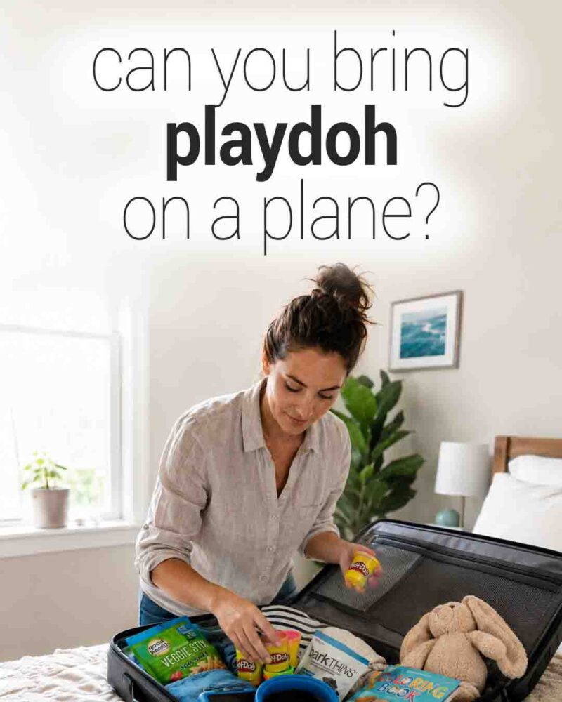 A woman packs colorful Play-Doh containers, snacks, a stuffed bunny, and children's travel items into a suitcase, beneath the text “Can you bring Play-Doh on a plane?”