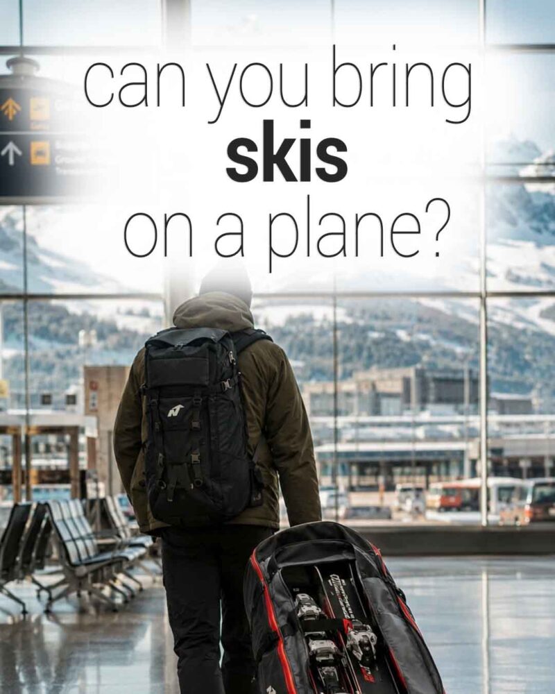 Traveler walking through an airport terminal pulling a ski bag, with snowy mountains visible through large windows and text reading “can you bring skis on a plane?”