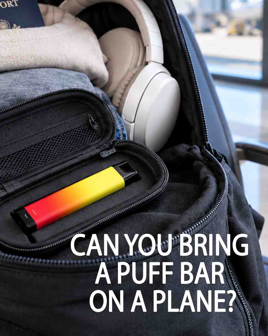 Open black backpack with travel essentials and a brightly colored red-and-yellow Puff Bar vape in a protective case at an airport