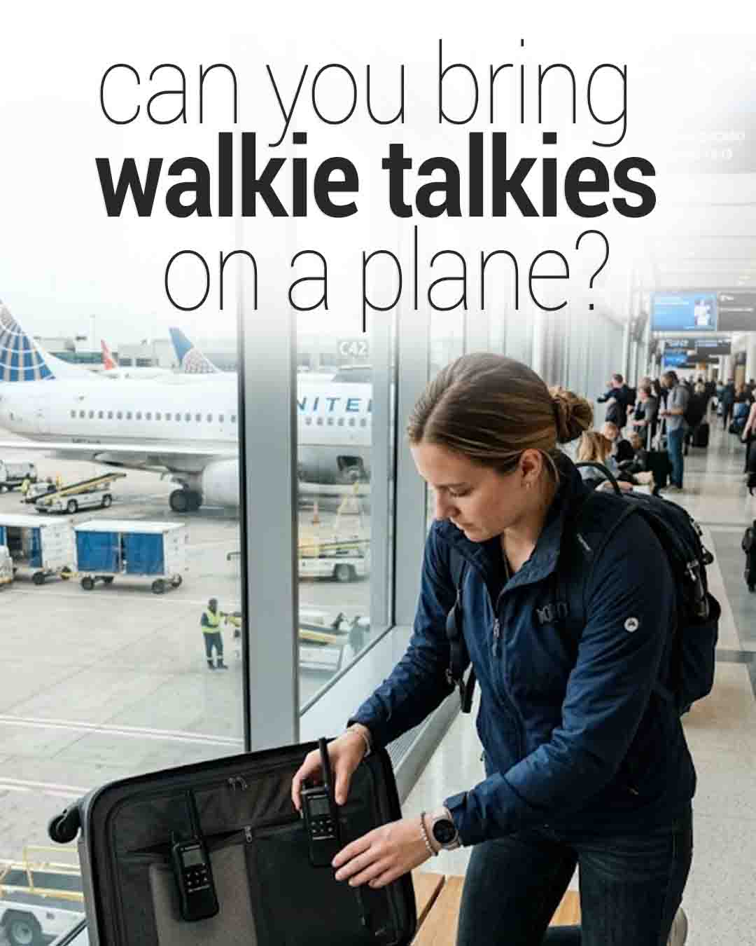 a woman in an airport terminal packing a pair of handheld walkie-talkies into a suitcase