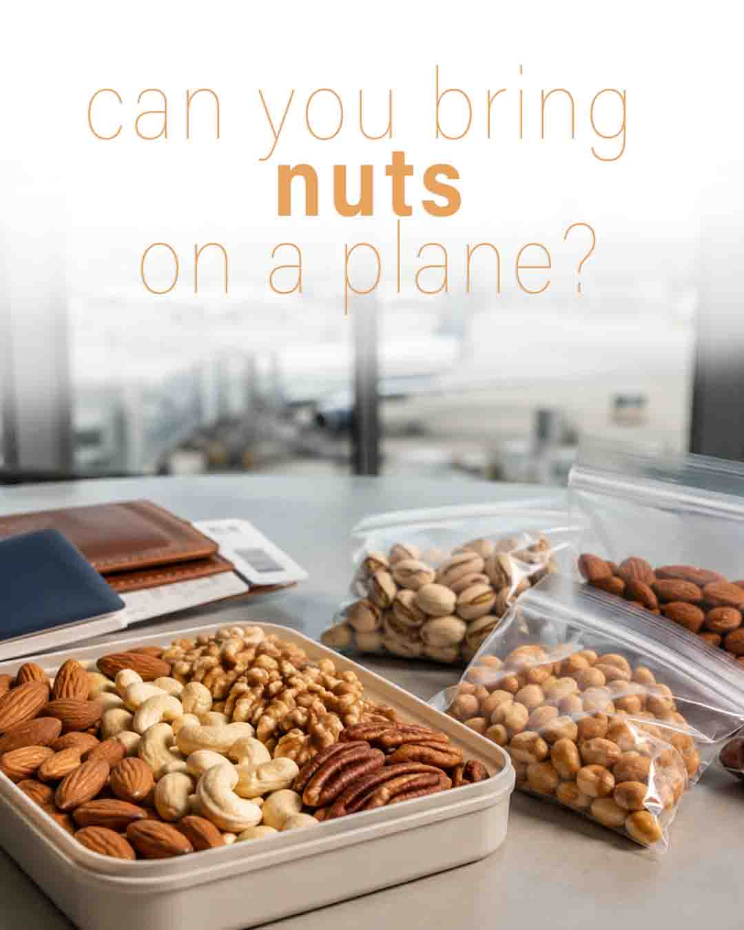Assorted nuts in a container and bags on an airport table beside travel documents